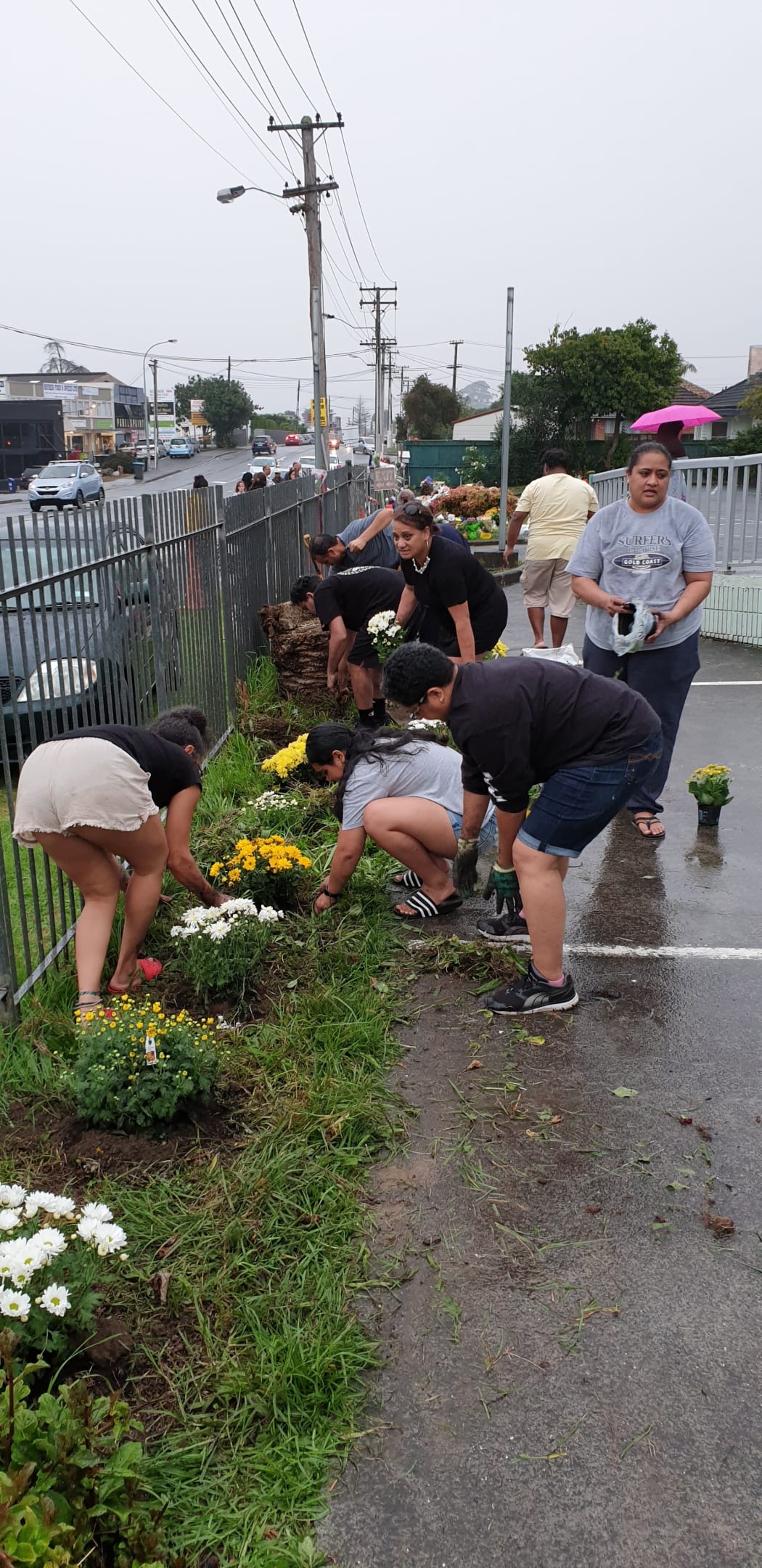 Rotumans plant flowers at the Masjid E Umar mosque in Auckland.