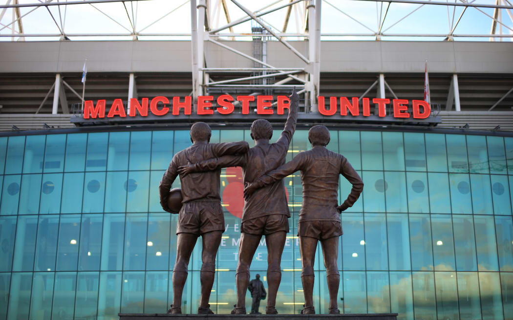 The trinity statue of Bobby Charlton (L), Denis Law, and George Best outside Old Trafford stadium.