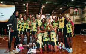 The Jamaica Sunshine Girls celebrate with the Taini Jamison Trophy after winning in the final. Taini Jamison Trophy, Final, New Zealand SIlver Ferns v Jamaica Sunshine Girls at North Shore Events Centre, Auckland, New Zealand. 24 March 2018 © Copyright Photo: Anthony Au-Yeung / www.photosport.nz