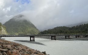 The Waiho River (Bailey) Bridge from the northern bank with existing rock protection.