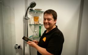 Sustainability Trust home assessor Karl Wheddon says phones in the shower are hampering efforts to cut energy and water usage