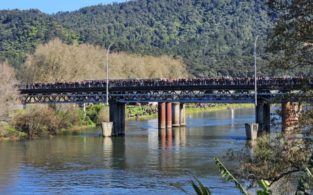 People gathered on the main bridge into Ngāruawāhia on the Thermal Explorer Highway, 5 September 2024.