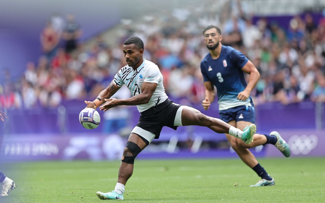 Fiji's Terio Veilawa attacks the French defence during the second day of the Paris 2024 Olympic Games at the Stade de France in Paris on July 25, 2024. Photo credit: Mike Lee - KLC fotos for World Rugby