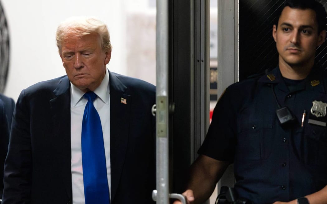 Former President Donald Trump returns to the courthouse moments before hearing that the jury had a verdict in his criminal trial at Manhattan Criminal Court, Thursday, May 30, 2024, in New York. (Justin Lane/Pool Photo via AP)