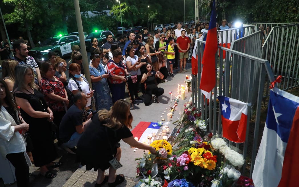 Supporters of Chilean former President Sebastian Piñera gather in a memorial in his honour outside his home in Santiago on February 6, 2024.