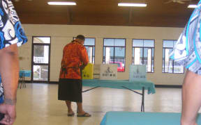 An election office team leader at the Ili’ili polling station opens ballot boxes for the 2016 general election in American Samoa.