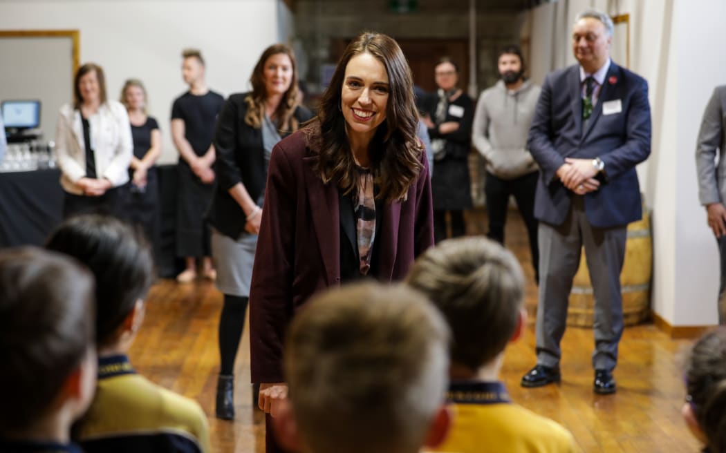 Jacinda Ardern talks to children