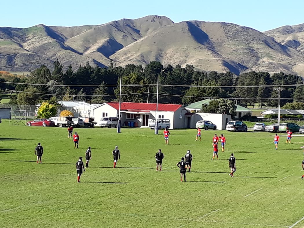 Oamaru old boys rugby football club (in black) vs Kurow (red)