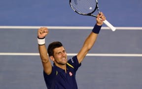 Novak Djokovic celebrating victory over Andy Murray to clinch another Australian Open title.