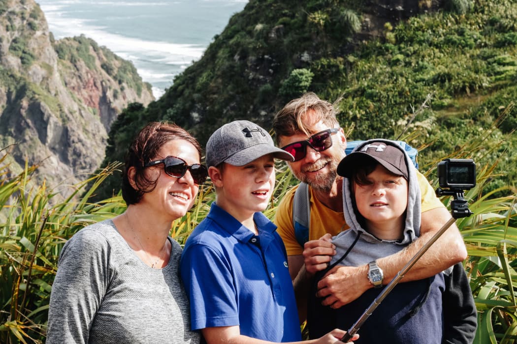 The Yenidogan family taking a selfie with their GoPro camera.