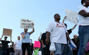Demonstrators protesting the shooting death of Michael Brown in Ferguson, Missouri.