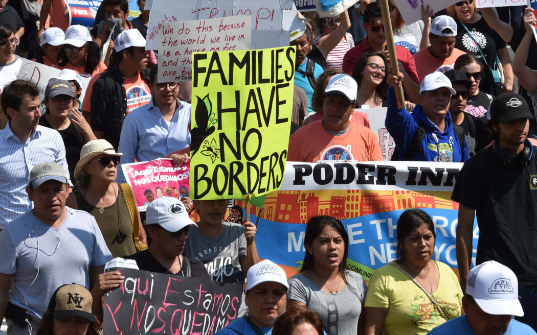 A rally in support of the Deferred Action for Childhood Arrivals (DACA) program in front of the Trump International Hotel, Washington DC, 5 September 2017.