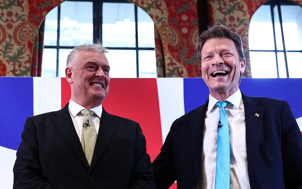 Former Conservative deputy chairman Lee Anderson (L) and Leader of Reform UK party Richard Tice (R) answer questions following a press conference to announce his defection from the Conservative party to Reform UK, in London, on March 11, 2024.