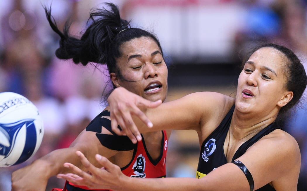 Temalisi Fakahokotau (left) and Aliyah Dunn battle for possession