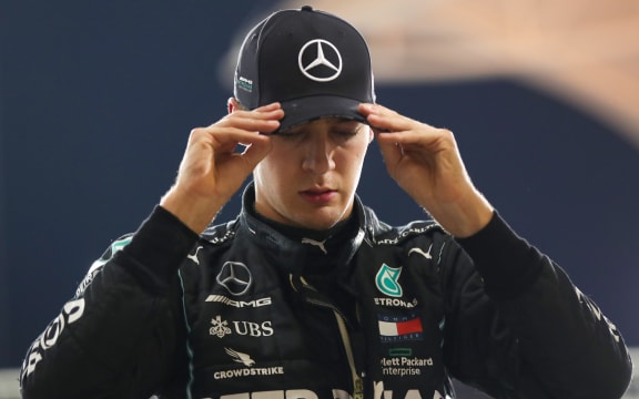 Mercedes' British driver George Russell is pictured in the pits after the qualifying session ahead of the Sakhir Formula One Grand Prix at the Bahrain International Circuit in the city of Sakhir on December 5, 2020.