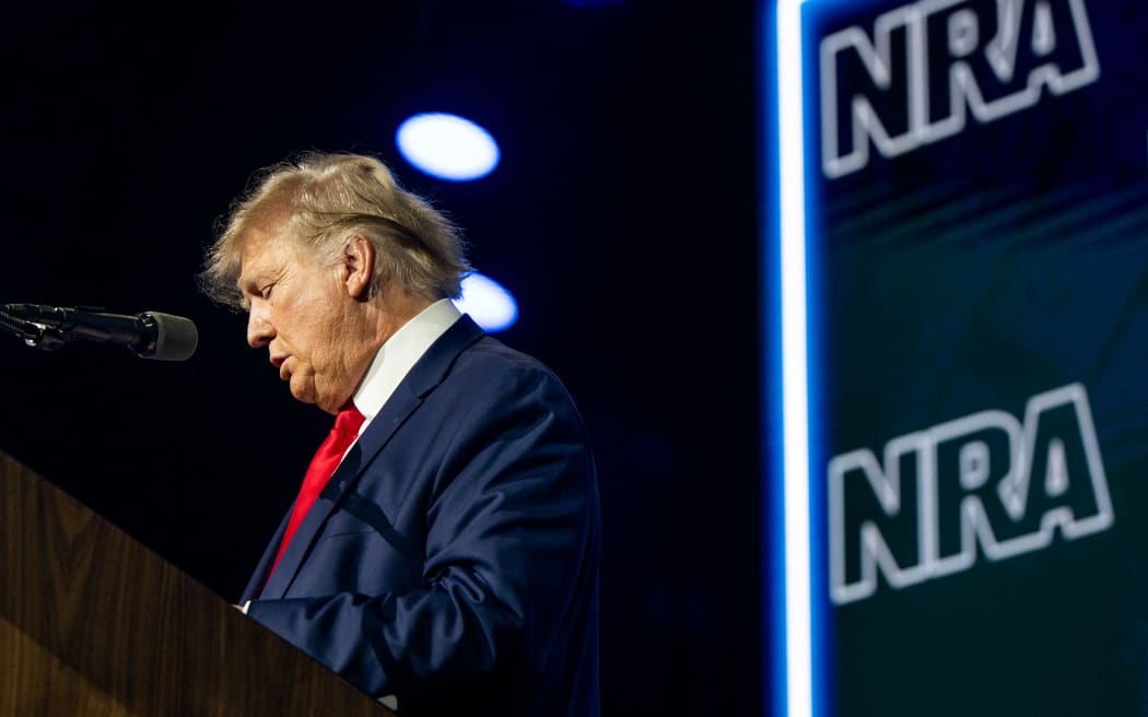 HOUSTON, TEXAS - MAY 27: Former U.S. President Donald Trump reads the names of the victims of the Uvalde mass shooting during the National Rifle Association (NRA) annual convention on May 27, 2022 in Houston, Texas. The annual National Rifle Association comes days after the mass shooting in Uvalde, Texas which left 19 students and 2 adults dead, with the gunman fatally shot by law enforcement officers.   Brandon Bell/Getty Images/AFP (Photo by Brandon Bell / GETTY IMAGES NORTH AMERICA / Getty Images via AFP)