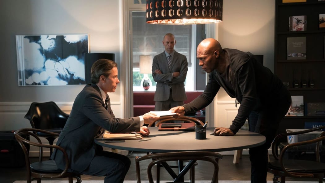 Guy Pearce and Eriq Ebouaney face off in Domino.
