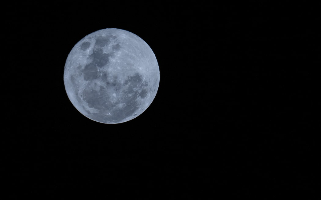 The super blue moon is seen in Christchurch, New Zealand on August 31, 2023. The blue moon is a term used to describe the second full moon in a single calendar month. But this year's blue moon also coincides with a supermoon, which is when the moon is at its closest point to Earth in its elliptical orbit, appearing larger and brighter than usual. It’s exceptionally close in Moon miles from Earth (222,043 miles). The last super blue moon occurred in 2009, and the next won’t be until 2037 according to NASA. (Photo by Sanka Vidanagama/NurPhoto) (Photo by SANKA VIDANAGAMA / NurPhoto / NurPhoto via AFP)