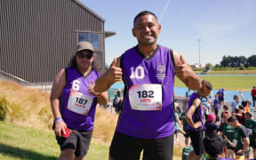 Silafai and Lutu give a confident thumbs up ahead of their relay event. Photo: Nabeelah Khan