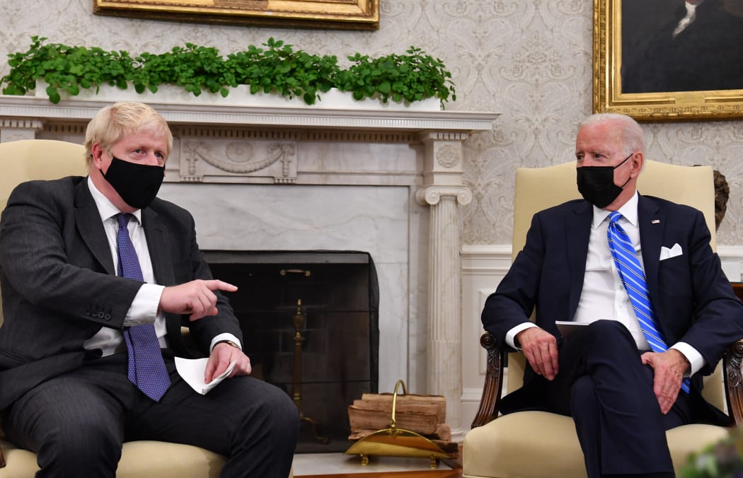 US President Joe Biden (R) holds a bilateral meeting with Britain's Prime Minister Boris Johnson at the Oval Office of the White House in Washington, DC on September 21, 2021.