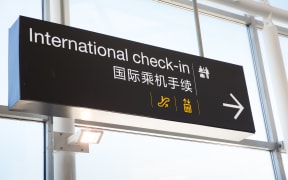 Signage for check-in at Auckland International Airport