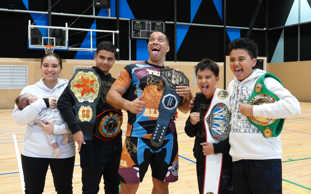 Dhcamad Armstrong performs a pukana with a few of his whānau.