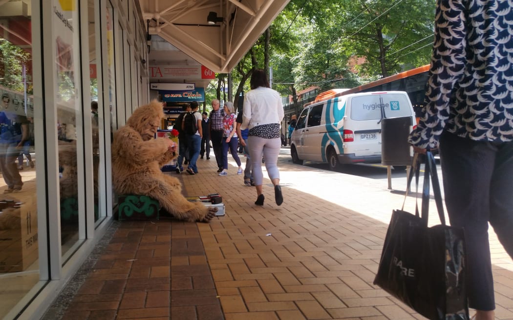 A person dressed as a gorilla begging in Wellington.