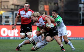 Faf de Klerk is tackled by Aaron Smith during the semi-final match.