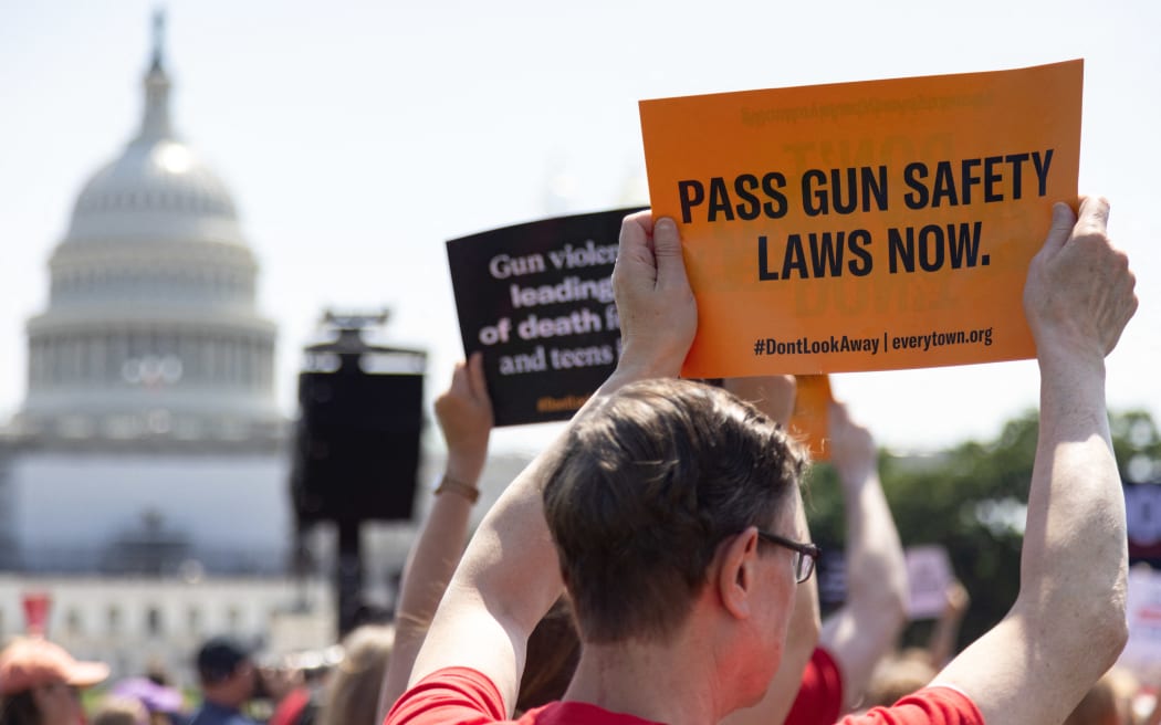 People attend a rally near the US Capitol on 8 June 2022, calling for Congressional action on gun safety in the wake of continued mass shootings.