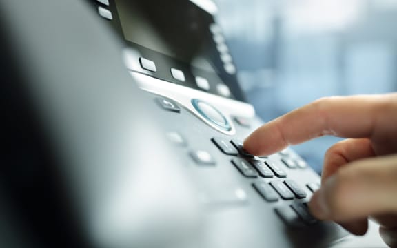 Dialing a telephone keypad.