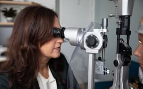 Professor and surgeon Helen Danesh-Meyer, Chair of Glaucoma New Zealand, examining a patient's eye