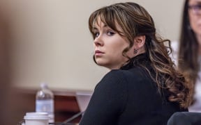 SANTA FE, NEW MEXICO - MARCH 06: Hannah Gutierrez-Reed, former armorer for the movie "Rust," listens to closing arguments in her trial at district court on March 6, 2024 in Santa Fe, New Mexico. Gutierrez-Reed, who was working as the armorer on the movie "Rust" when a revolver actor Alec Baldwin was holding fired, killing cinematographer Halyna Hutchins and wounding the film's director Joel Souza, was found guilty of involuntary manslaughter but acquitted on charges of tampering with evidence. She could face up to 18 months in prison.   Luis Sánchez Saturno - Pool/Getty Images/AFP (Photo by POOL / GETTY IMAGES NORTH AMERICA / Getty Images via AFP)