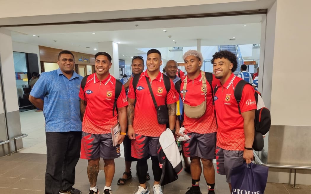 Charles Piutau, second left, and the Tonga 15s players at the Nadi International Airport in Fiji. 20 July 2023.