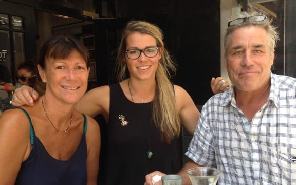 Chessie Henry (centre) with her mum, Esther, and father, Chris.