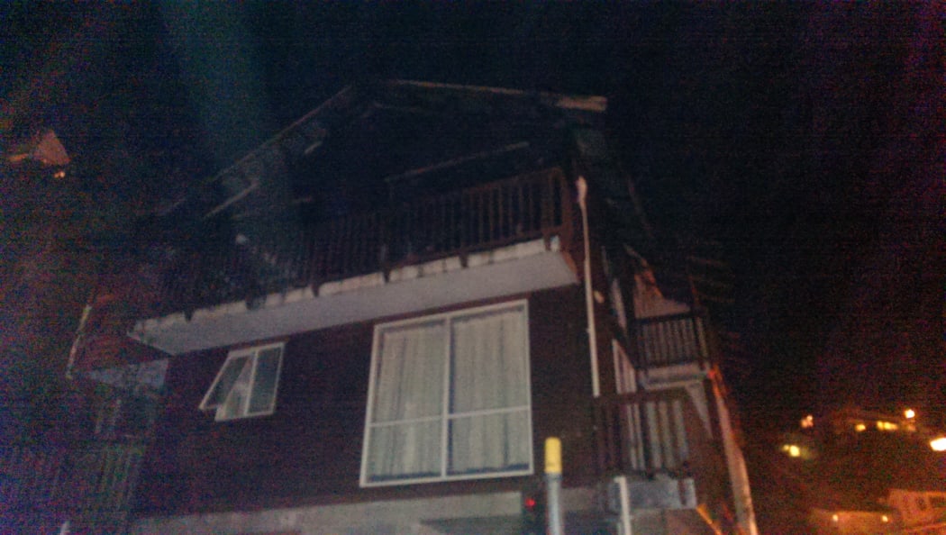 The fire-damaged house.