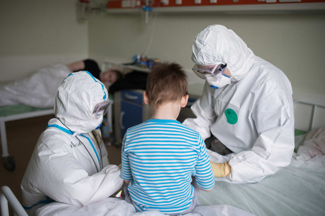 Medical workers in Russia's National Medical Research Center for Children's Health where children with COVID-19 coronavirus infection are treated, in Moscow.