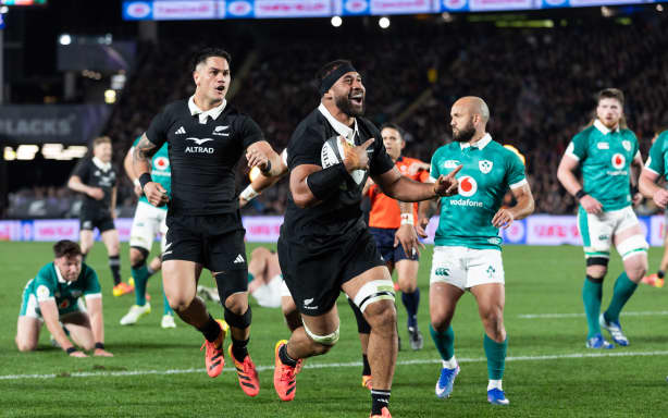 All Blacks lock Patrick Tuipulotu celebrates after scoring.