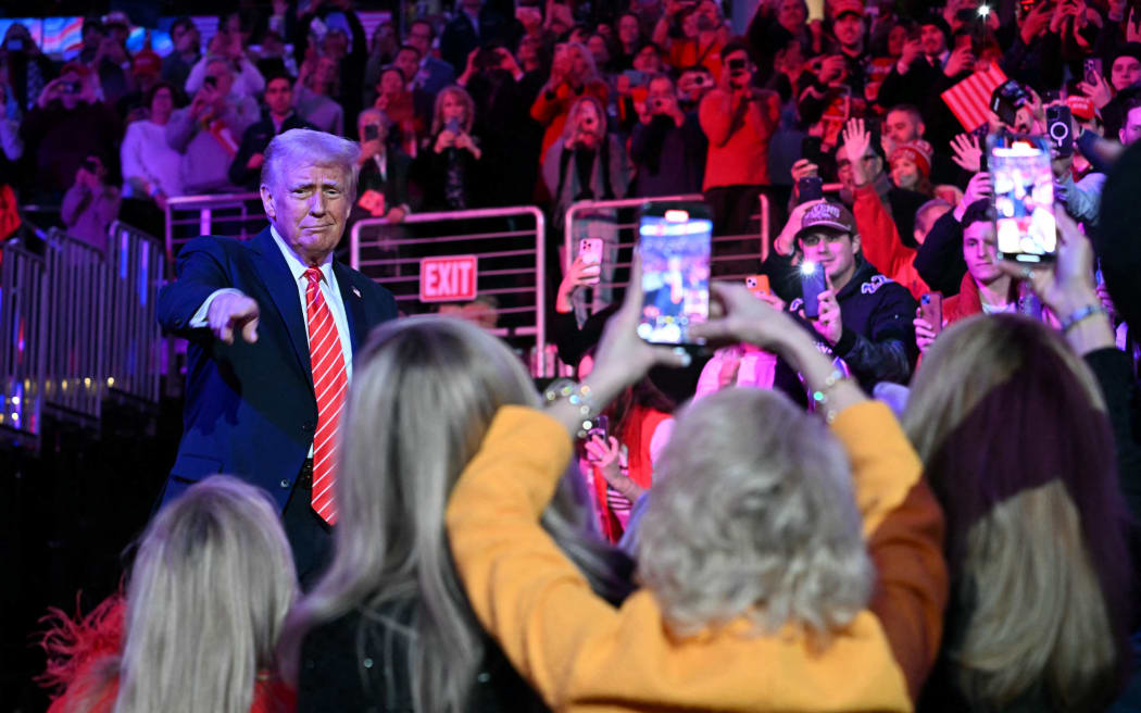 US President-elect Donald Trump arrives to speak at a MAGA victory rally at Capital One Arena in Washington, DC on January 19, 2025, one day ahead of his inauguration ceremony. (Photo by Jim WATSON / AFP)