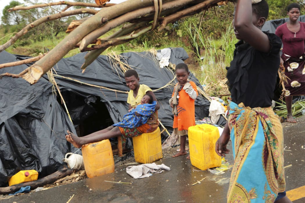 Survivors of Cyclone Idai in a makeshift shelter by the roadside near Nhamatanda about 50 kilometres from Beira, in Mozambique,