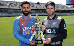 Black Caps captain Kane Williamson and Indian skipper Virat Kohli with the trophy for their T20 series in New Zealand.