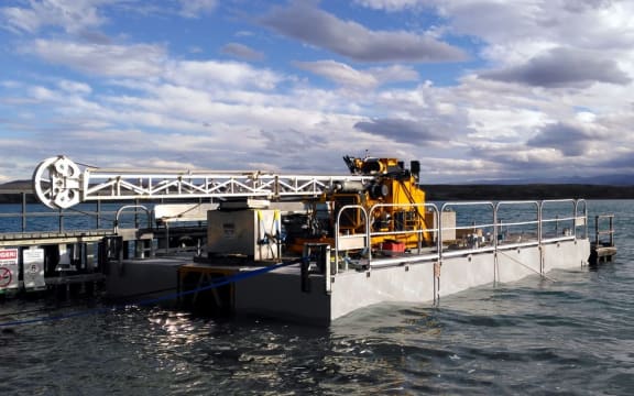 The drill rig is waiting to be towed out onto Lake Ohau.