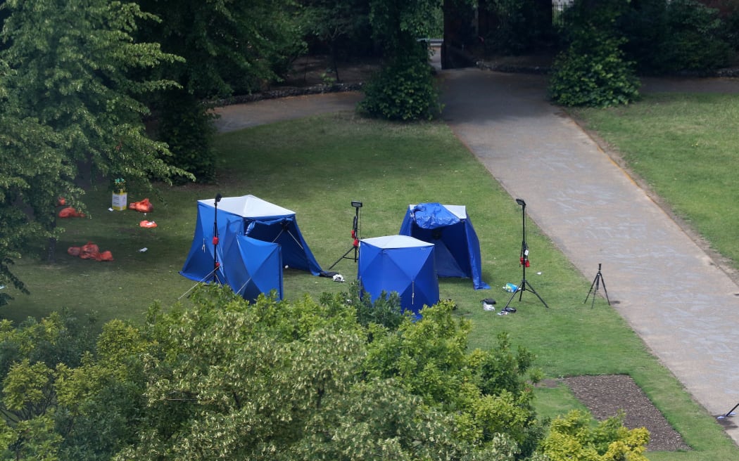 A picture shows police tents and equipment at the scene of a fatal stabbing incident that is being treated as terrorism in Forbury Gardens park in Reading, west of London, on June 21, 2020.