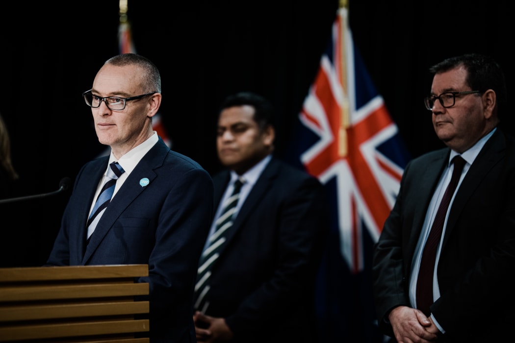 David Clark announcing his resignation as minister of health alongside Minister of Commerce and Consumer Affairs Kris Faafoi and Finance Minister Grant Robertson.