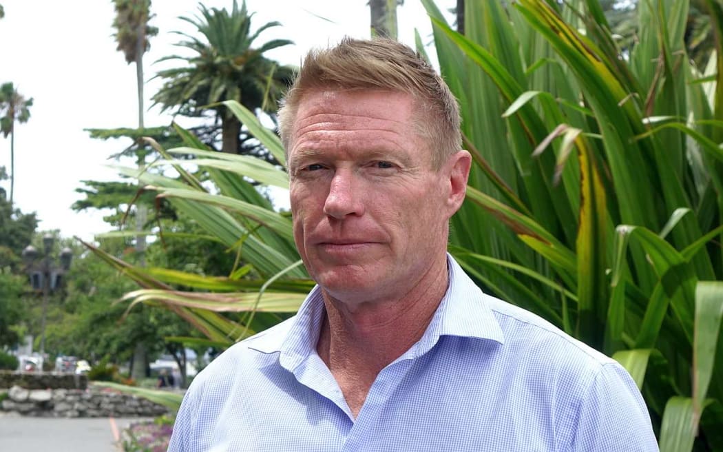 Head and shoulders of man outside