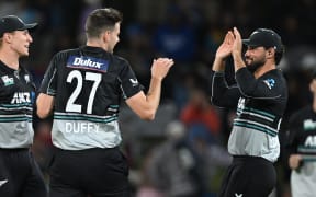 New Zealand's Jacob Duffy and Tim Robinson celebrate the wicket of Sri Lanka's Kusal Perera during the second T20 international against Sri Lanka at Mount Maunganui, 30 December, 2024.