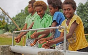 Ni-Vanuatu girls use a new handwashing station