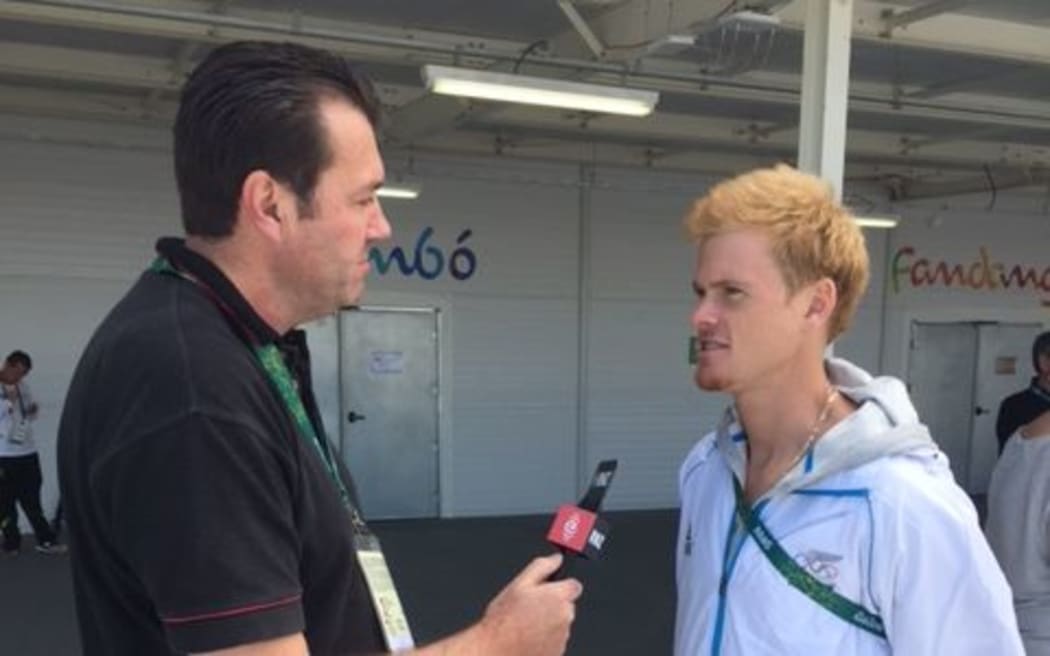 New Zealand athlete Zane Robertson being interviewed by Stephen Hewson.