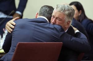 SANTA FE, NEW MEXICO - JULY 12: Alec Baldwin hugs his attorney Alex Spiro at the conclusion of his trial for involuntary manslaughter in First Judicial District Court on July 12, 2024 in Santa Fe, New Mexico. The trial for involuntary manslaughter was dismissed by a judge Friday after she ruled that key evidence over a fatal shooting on the set of "Rust" had been withheld from the defense.   Ramsay de Give-Pool/Getty Images/AFP (Photo by POOL / GETTY IMAGES NORTH AMERICA / Getty Images via AFP)