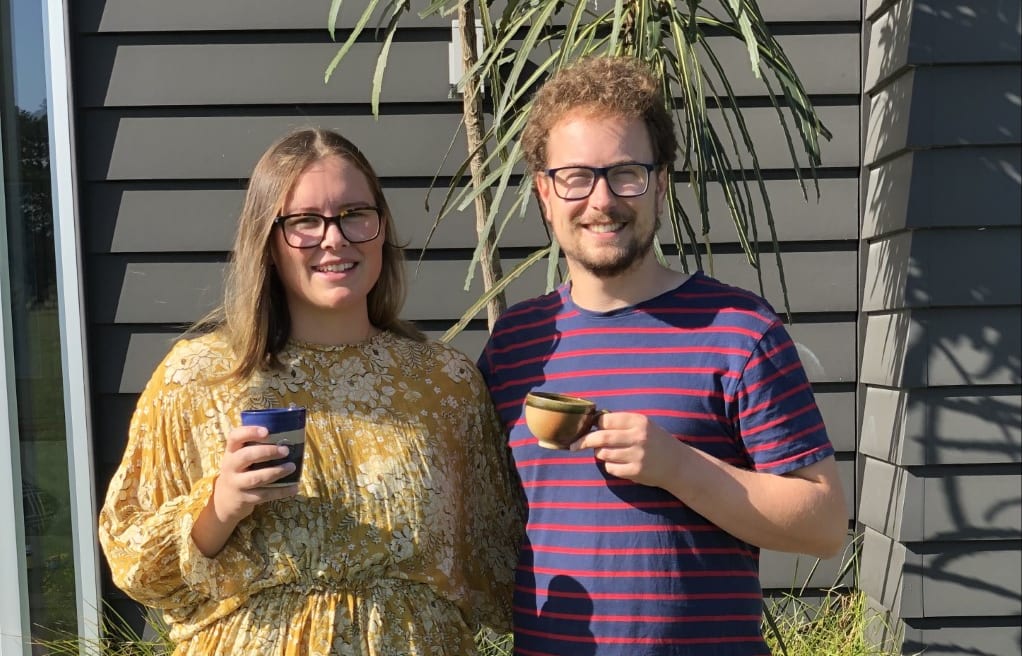 Jono Broom of Bean Merchant enjoys a cuppa with his partner Maddie Hullena.