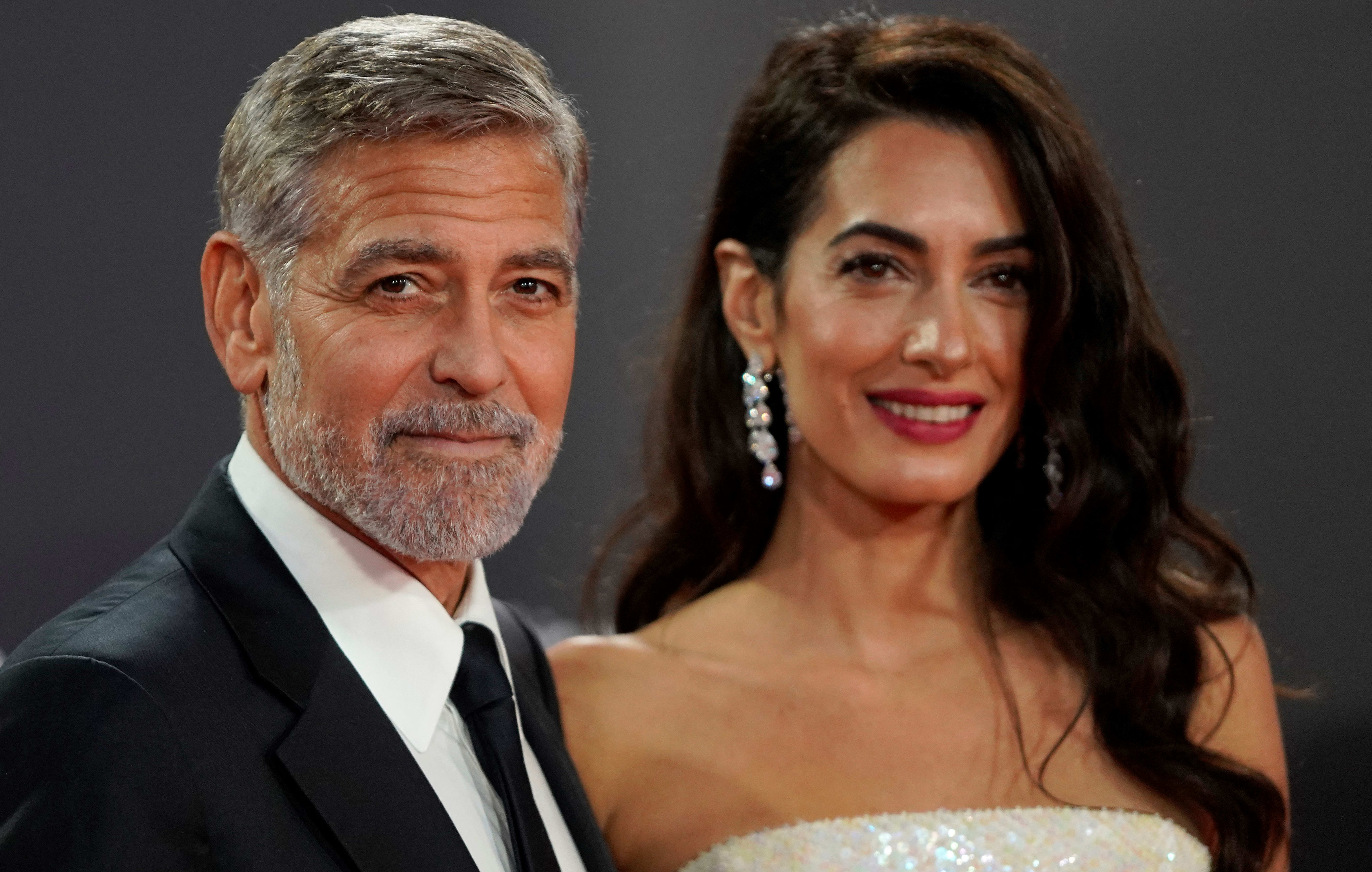 Actor George Clooney and his wife barrister Amal Clooney pose on the red carpet at the London Film Festival, on 10 October.